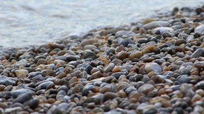 IMAGE: There are plenty of other pebbles on the beach. [There are plenty of other pebbles on the shore].