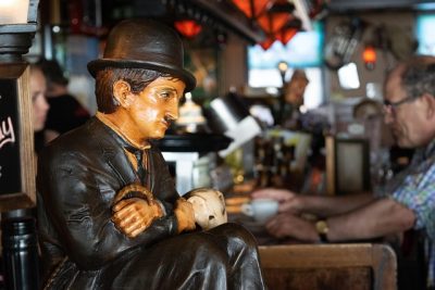 IMAGE: Smile, though your heart is aching; / Smile, even though it's breaking; / When there are clouds in the sky, you'll get by. // If you smile through your fear and sorrow; / Smile and maybe tomorrow; / You'll see the sun come shining through / for you. // Light up your face with gladness; / Hide every trace of sadness; / Although a tear may be ever so near. // That's the time you must keep on trying; / Smile, what's the use of crying; / You'll find that life is still worthwhile / If you'll just: Smile. //